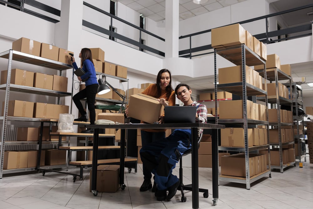 postal-workers-checking-parcel-invoice-on-laptop-b-2025-02-17-22-07-38-utc (1)